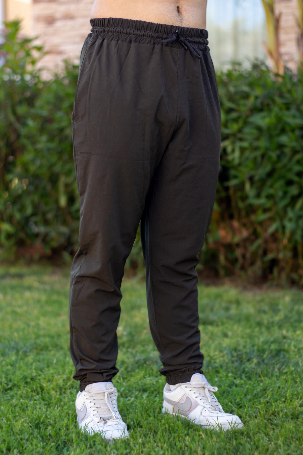 Erkek Haki Paraşüt Kumaş Bilek ve Bel Lastikli İpli Rahat Basic Eşofman Altı 24EESAOMPA